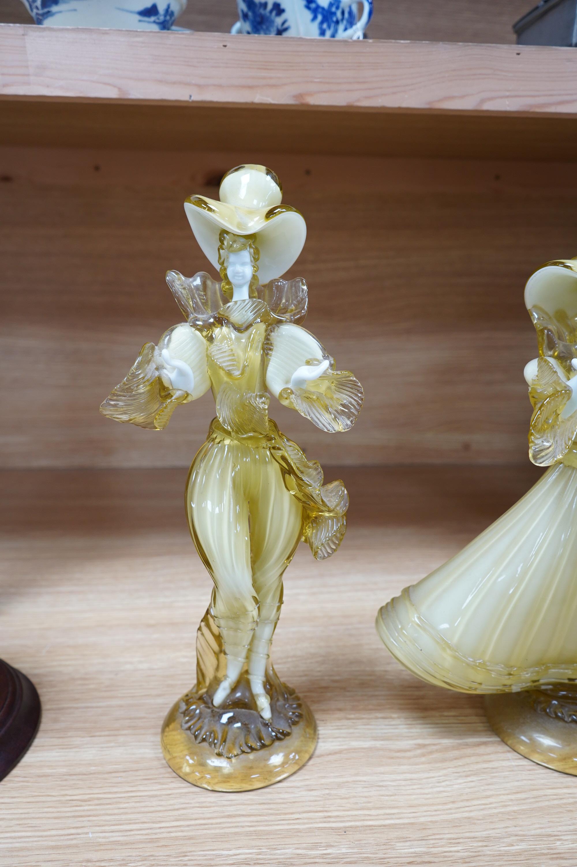 A pair of Murano amber and cream glass figures, tallest 38cm high. Condition - good